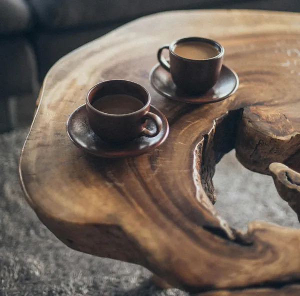 Coffee mugs on a wooden table